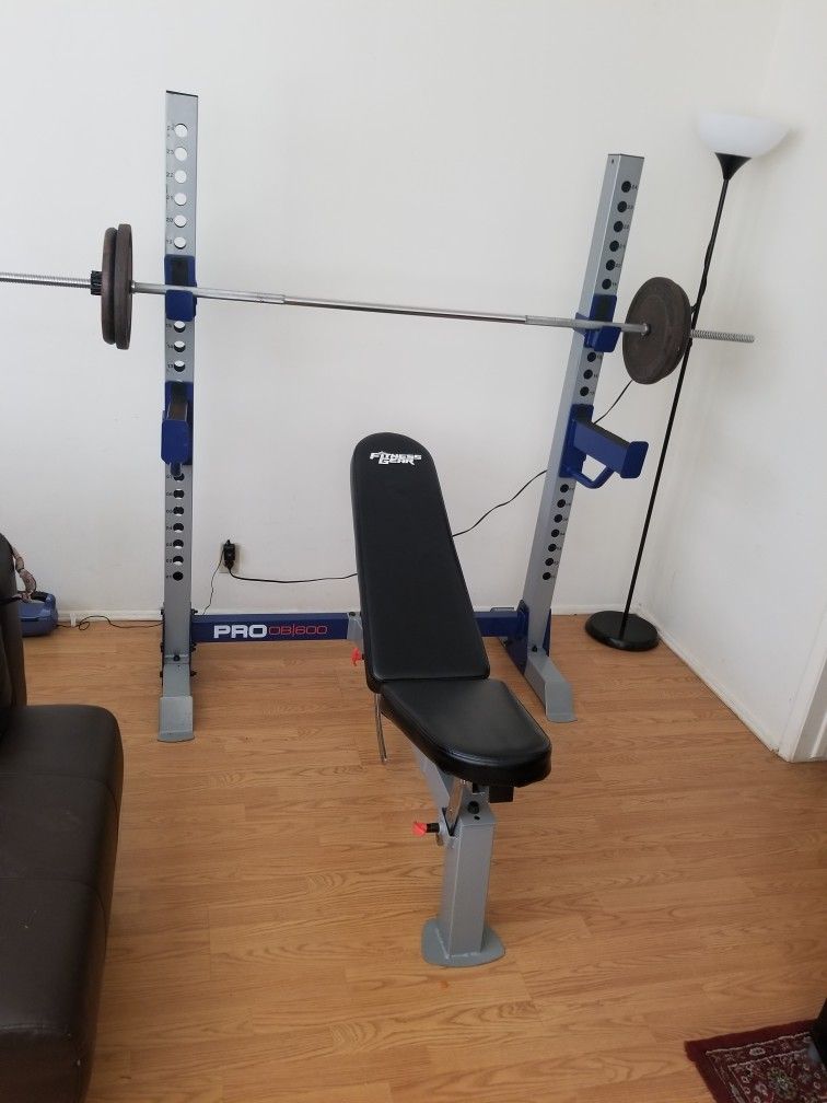 Fitness Gear Pro Olympic Weight Bench With Standard weights set.