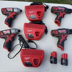 Assortment of Milwaukee Drills, Impact Drivers, Chargers, and Batteries 