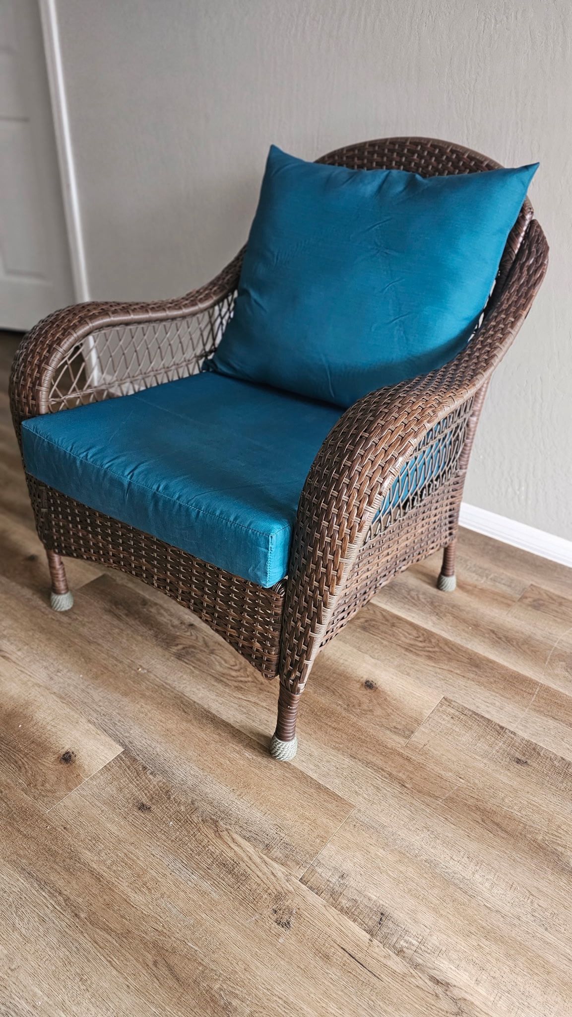 Brown Wicker Armchair with Teal Cushions