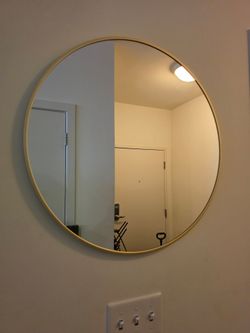 Circular mirror with gold frame