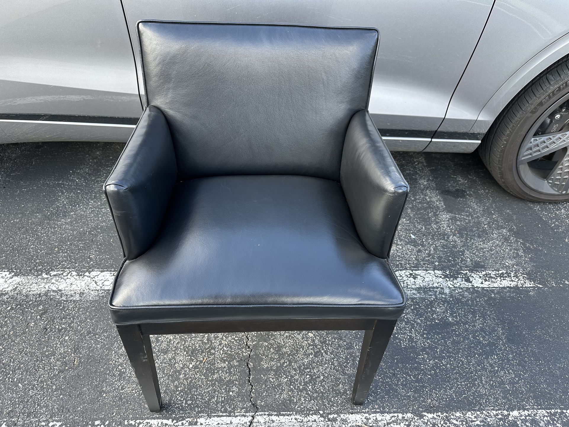 Leather chair Black Color In good Room Board Ansel