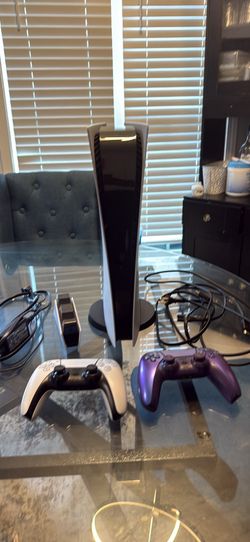Ps5 with 2 controllers, charging stand, and a 1TB SSD