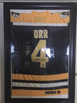 Autographed Bobby Orr framed jersey (with certification of authenticity)