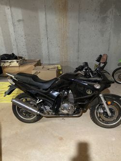 Tank Sports Black Motorcycle with Silver Accents