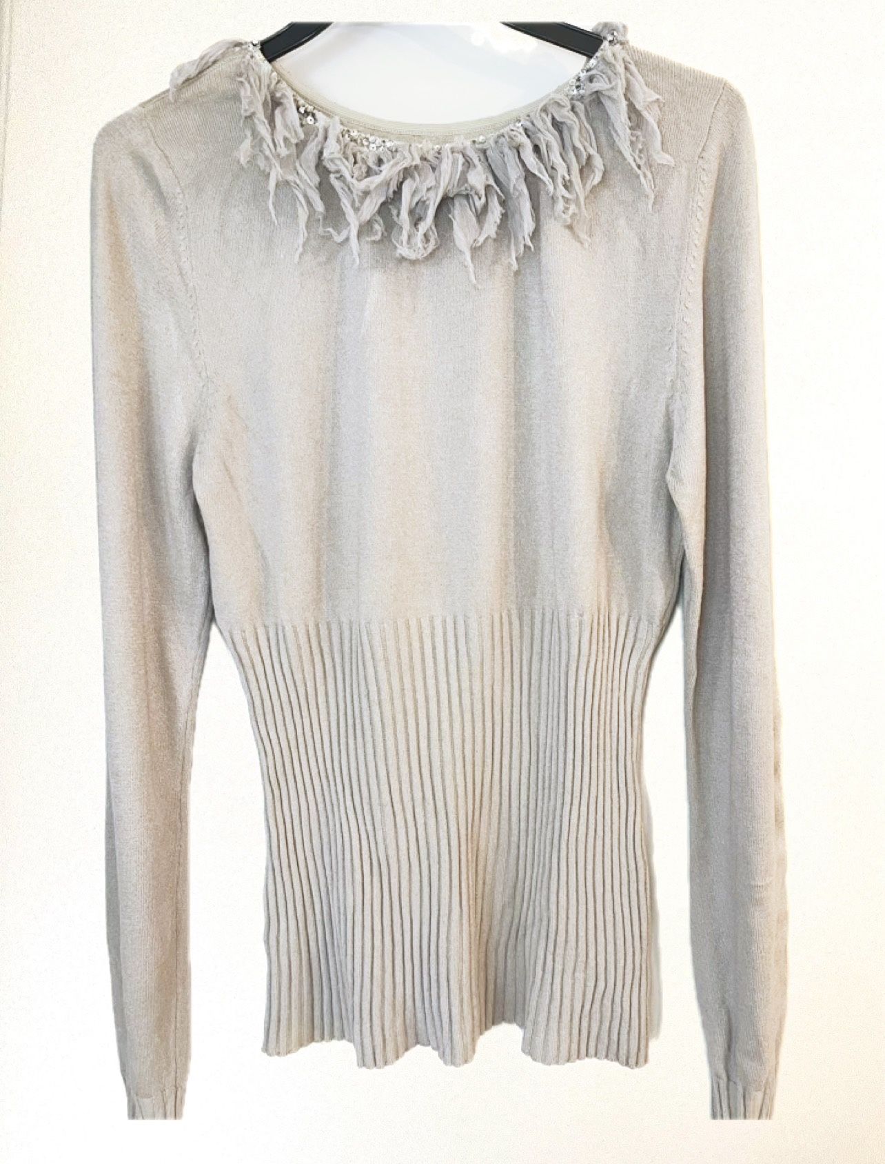 Beautiful light gray Tunic fit top with silver round neck feather accents, long sleeve. Size 4