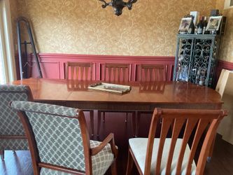 Ethan Allen Dining room table , leaf, table pad , six chairs and buffet