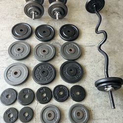 Weightlifting equipment. With curling bar and two dumbbells and a regular bar all over 200 pounds all for $160.