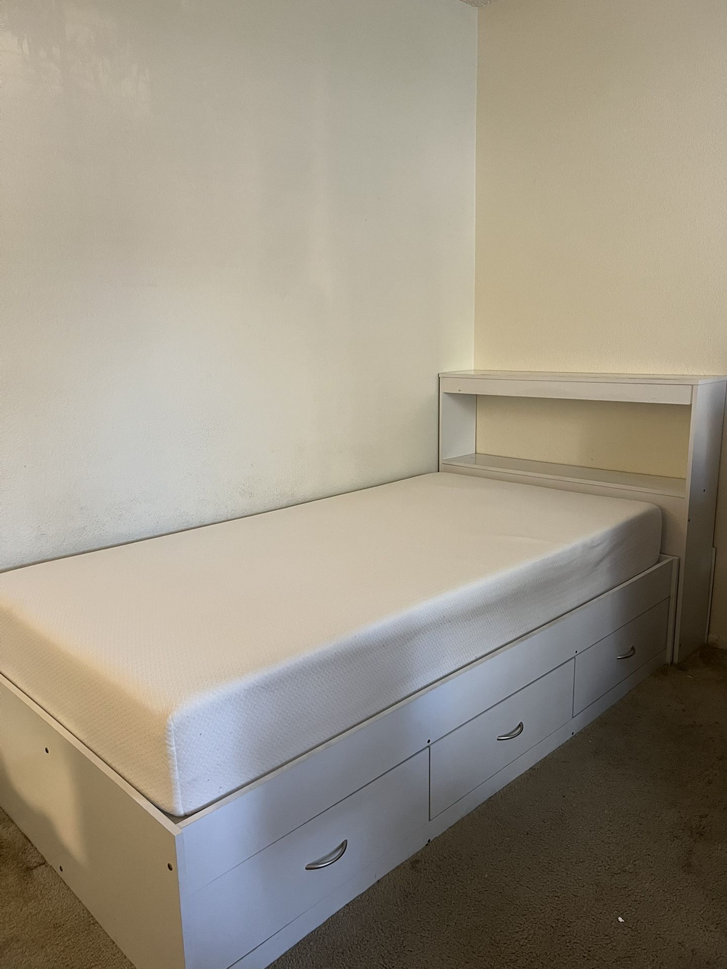 Twin bed frame with drawers and foam mattress