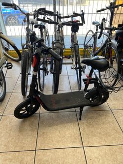 Skute electric scooter with seat and basket