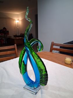 Art Glass Sculpture Blue and Green Murano Art Glass. Has a chip in the bottom back side of base which you can not see when setting it up from the fron