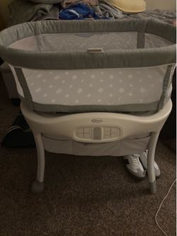 Bassinet with newborn clothes