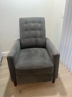 Recliner manual pushback