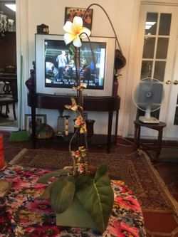 Faux flower plant with vase