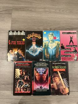 Lot of vintage VHS tapes with a mix of classic movies and popular titles.  Includes: 	•	Blade Runner (Director’s Cut) 	•	Star Trek V: The Final Fronti