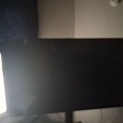 TCL 65 INCH ROKU TV ON SWIVEL STAND .