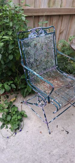 Antique metal rocking chair