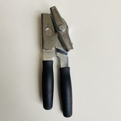 Antique Famous Swing-A-Way Universal Can/Bottle Opener. Like new condition. Great bargain.