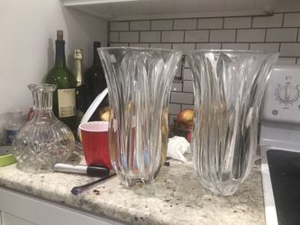 Two Gorgeous flower vases. Very thick and heavy. Bought for $40 a piece and used only one of them once. My loss your gain.