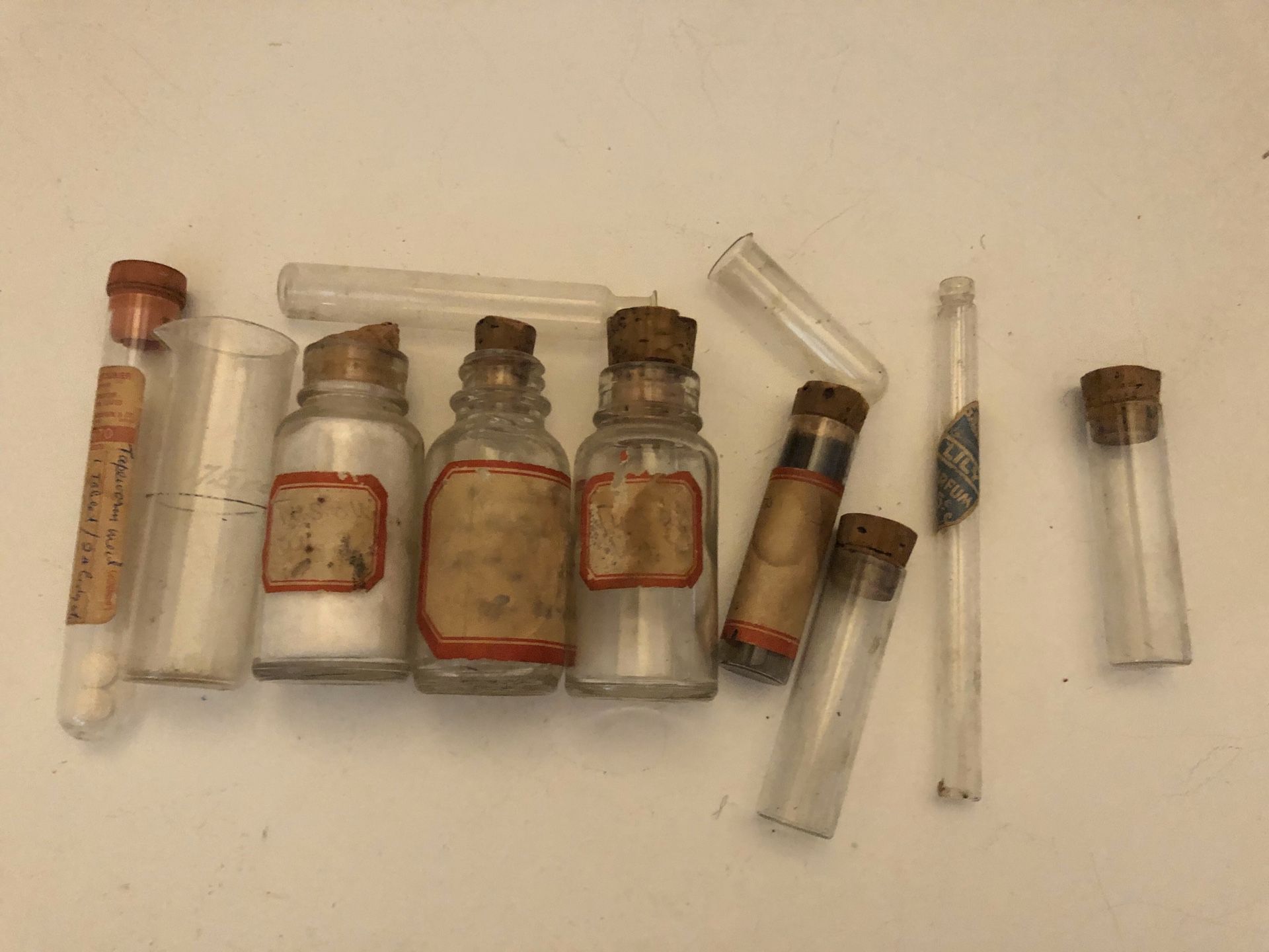 Antique pharmacy bottles (one is a tapeworm med. with 2 pills left)