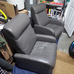 Two Gray Leather Recliner Chairs