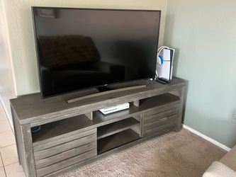 Gray TV Console with Sliding Doors
