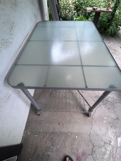 Metal table with glass top