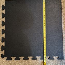 Interlocking rubber floor tiles