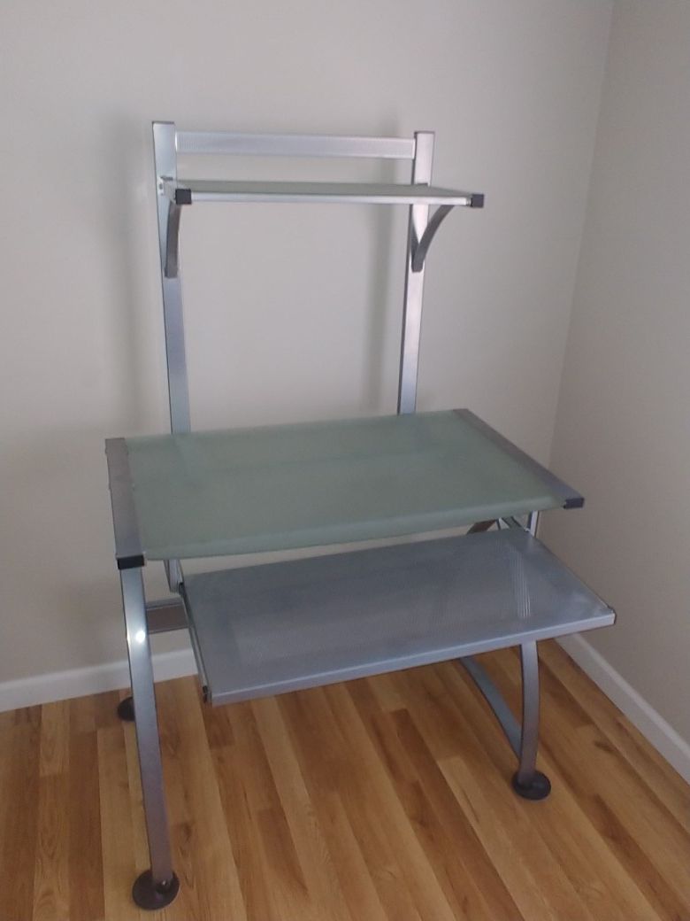 Computer desk with bookshelve. Glass and metal with slide out keyboard tray.