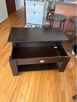 Sold wooden coffee table with storage