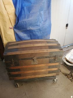 antique camelback steamer trunk, dating from the late 19th or early 20th century.