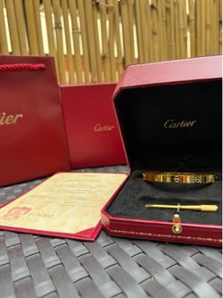 Gold Cartier love bracelet