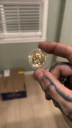 Gold-Toned Coin in Protective Capsule