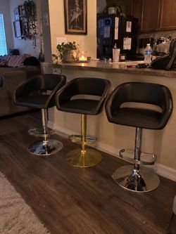 Set of 3 beautiful contemporary low-back counter stools that adjust up to bar height,  $140 for all