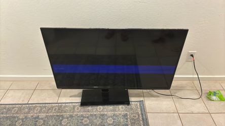 60-65” Toshiba TV  Used (Slightly Dark Spot)