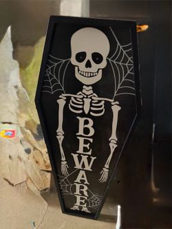 Large skeleton coffin needs battery approximately 3 feet tall, eyes light up