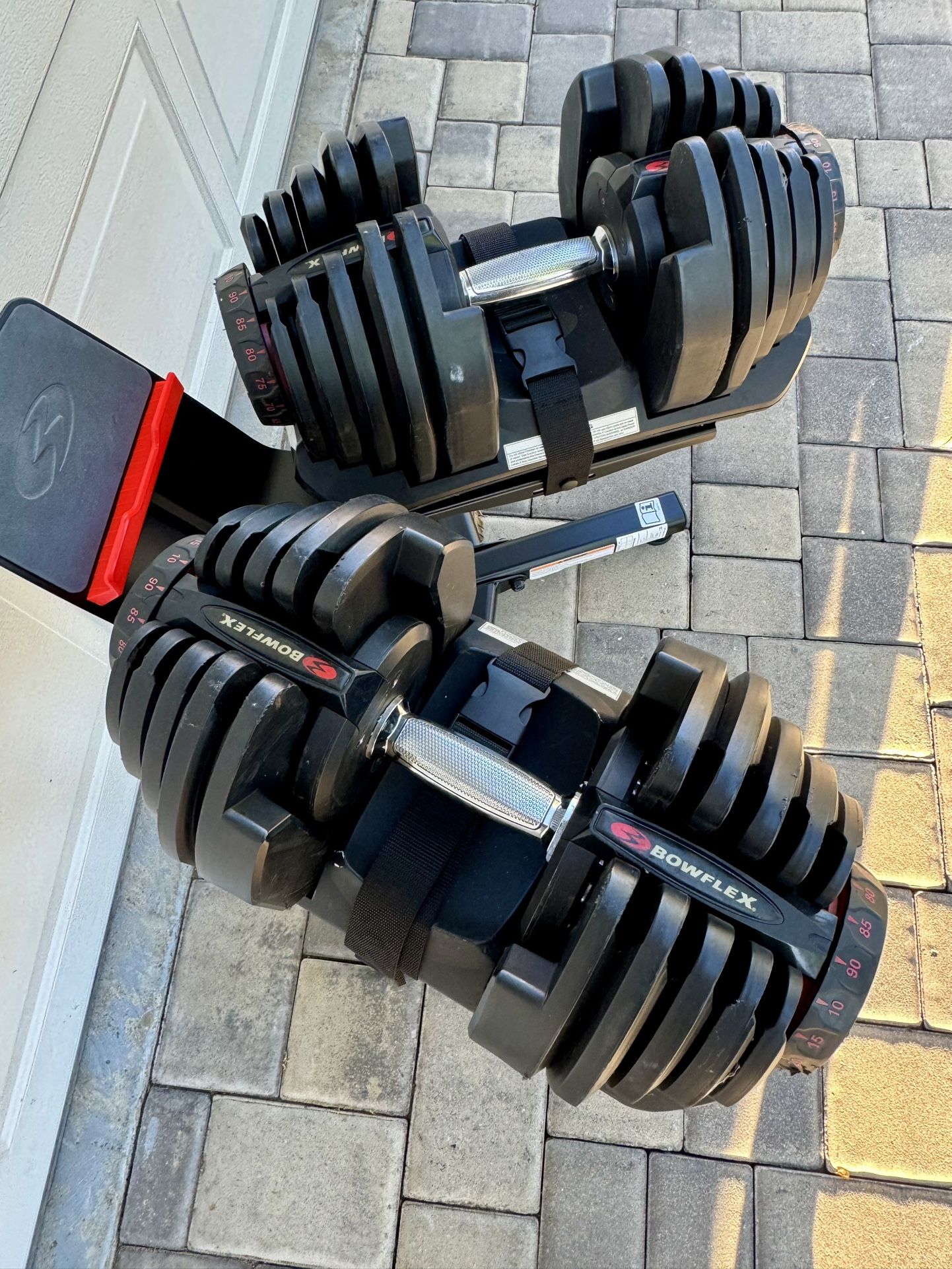 Pair Of Bowflex 1090 Adjustable Dumbbells With Media Stand
