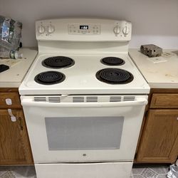 GE refrigerator & stove and hood vent & dish washer Cream color