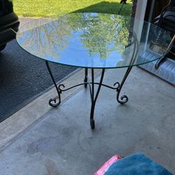 Must Sell Make Reasonable Offer New condition, 48 inch round grass top with iron base and one chair of four with new cushions shown in photo