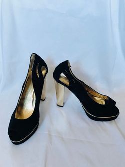 Pair of black and gold heels