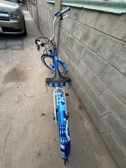 Electra Shibori Cruiser Go! Step-Thru electric bike featuring an indigo-to-white fade design