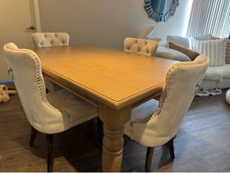 Dining table with cream chairs