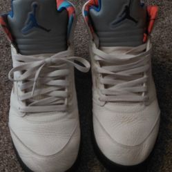 Air Jordan 5 Retro "International Flight" "Sail/Orange Peel" colorway).