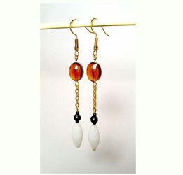 Contemporary earrings with amber colored oval glass crystal beads and oblong white beads