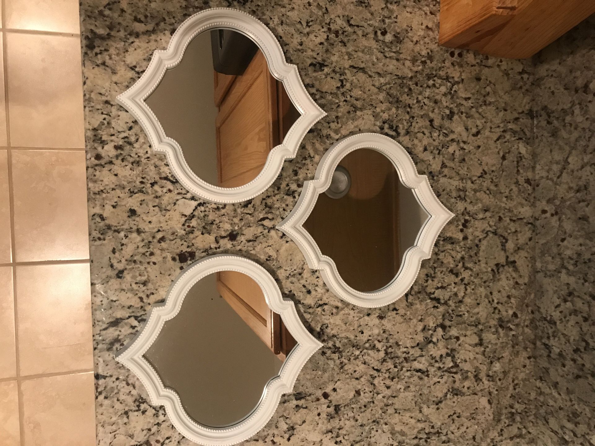 3 decorative white mirrors