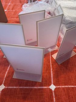 Acrylic frames 36 pieces. Size 4” x 6” vertical. Gold line edge. Brand new. Graduation wedding.
