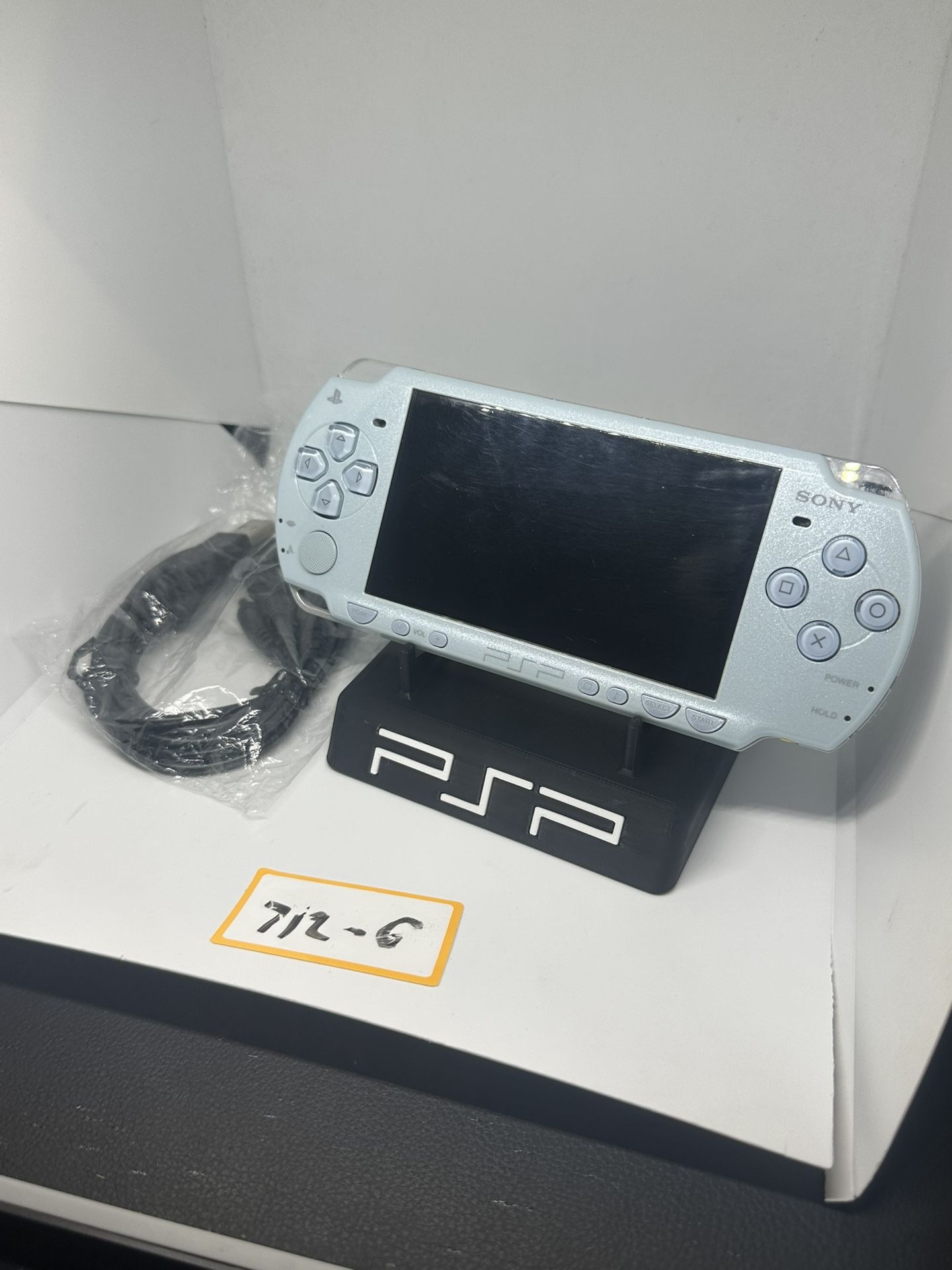 PSP 2000 light blue w/charger & new battery!