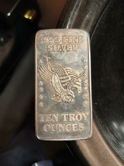 Ten Troy silver