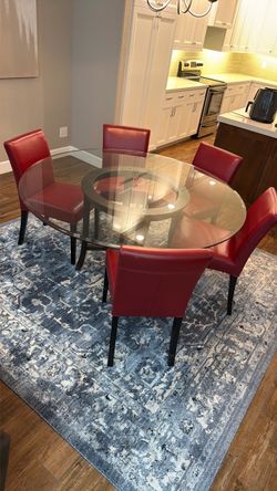 Round Glass Dining Table with 6 Red Chairs