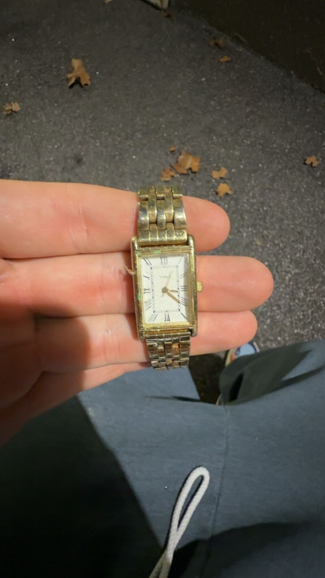 gold-toned vintage Timex Tank quartz watch with a metal bracelet band