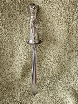 Antique letter opener heavy stainless wth knight as handle and pummel 